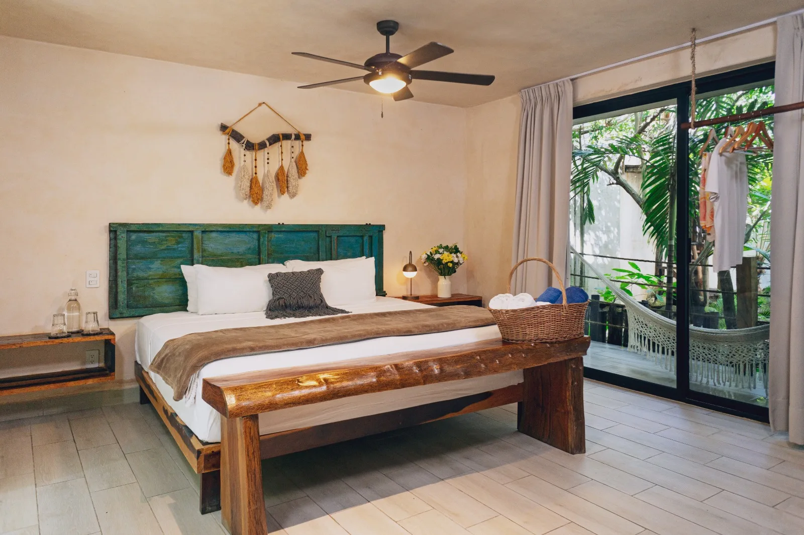 King room with green headboard at Sunset Tulum